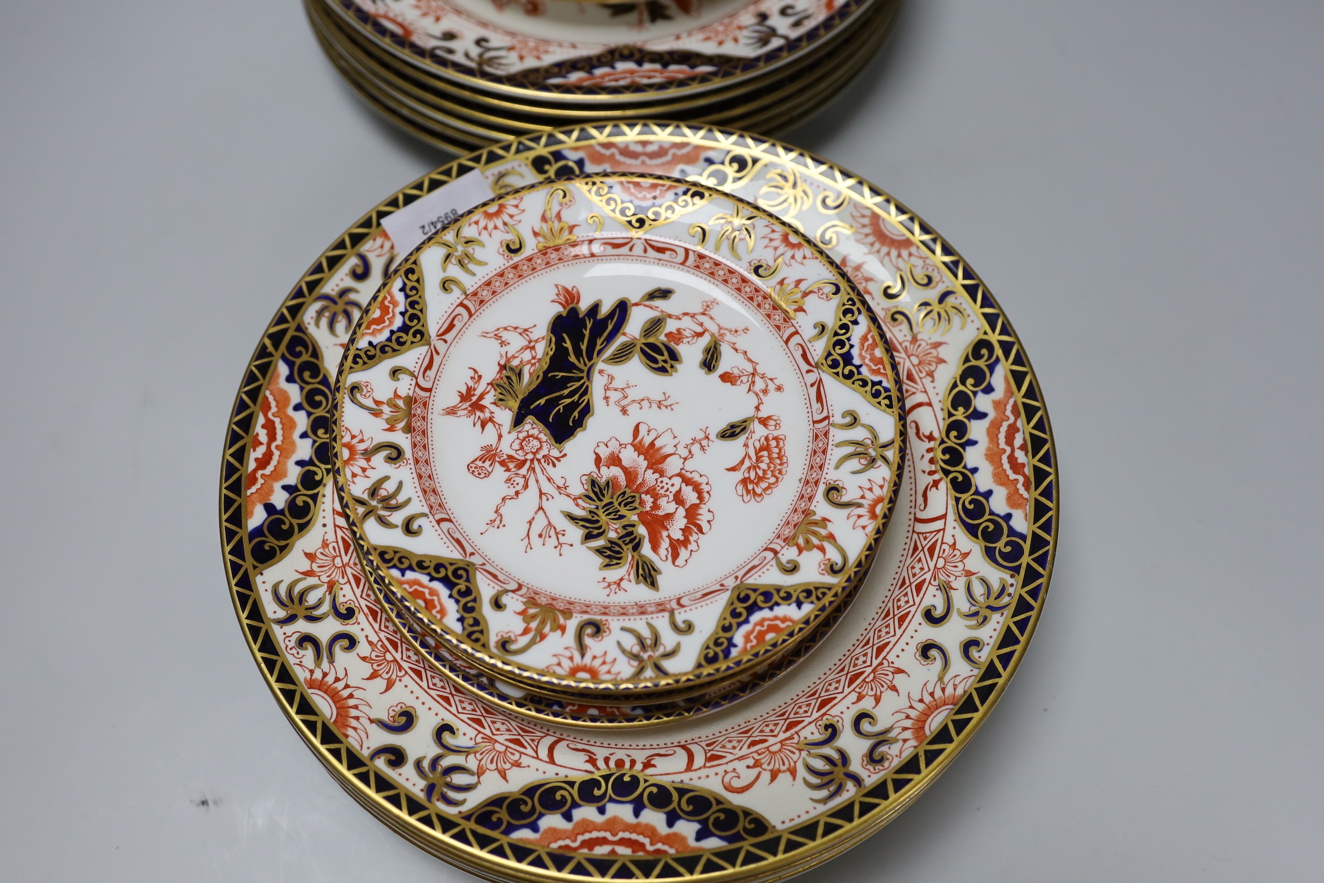 A part set of Royal Crown Derby Imari pattern plates (12 large and 11 small) 17cm & 26cm